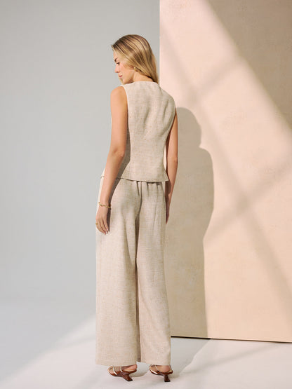 Set van metalen knopvest en Brede broek